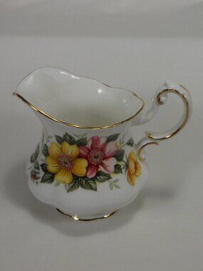 Paragon UK bone china creamer. colorful floral , gold rim